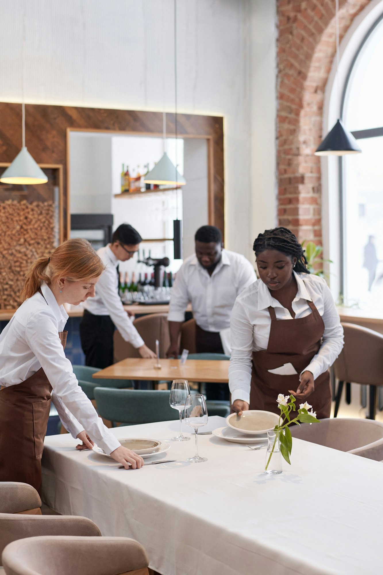 waiters preparing tables in restaurant